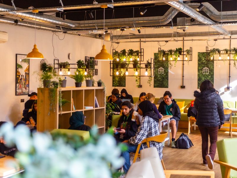 People sat inside The Greenhouse Café 