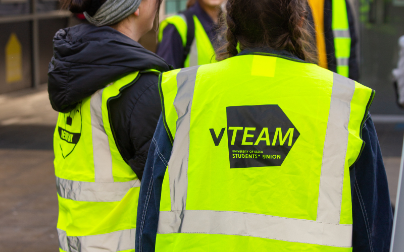 The back of an essex student wearing a VTeam hi-vis