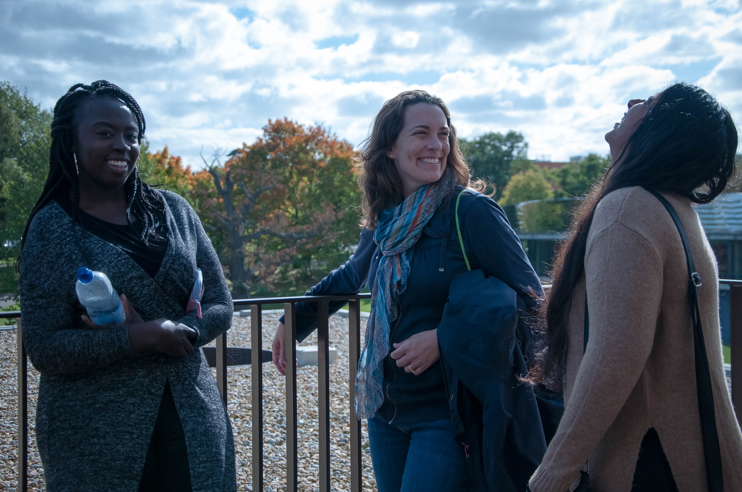 three essex students laughing and smiling