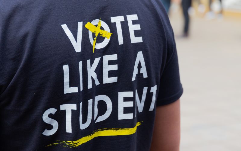 vote like a student written on a tshirt